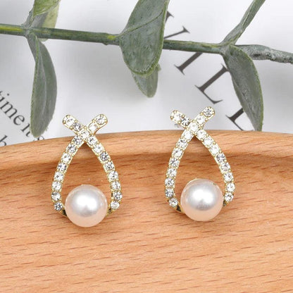 Perlen-Ohrringe mit Glitzer von Rose & Oliver, im eleganten Stil, mit glänzenden Details aus Kristallen und Imitationsperlen.