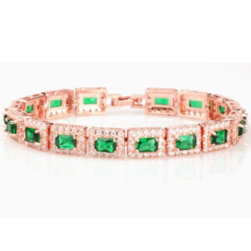 Goldenes Armband mit grüner Smaragd-Akzent, von der Marke Rose & Oliver, mit eleganten Details und raffiniertem Design.